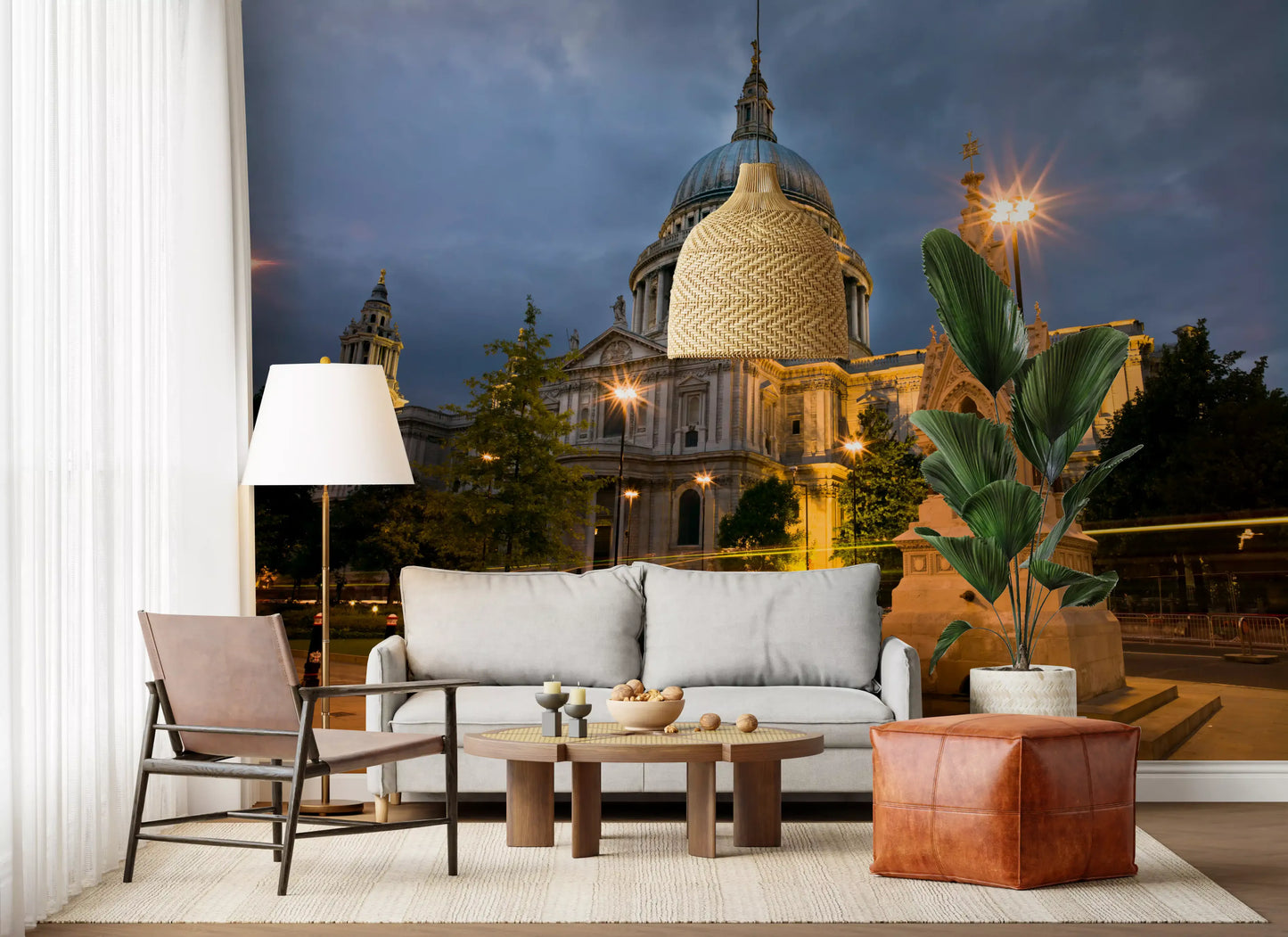 Warm-lit cathedral wall mural mounted on a living room under storm clouds