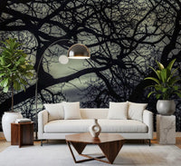 Dark branching Lunar Silhouette wall mural covering a living room in teal and black, GD9749