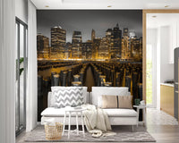 Manhattan night skyline wall mural seen from a Living room in gold and grey