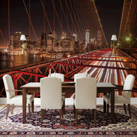 Night bridge and city lights wall mural installed in a dining room