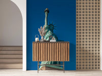 Teal-green Statue of Liberty wall mural on cobalt blue background