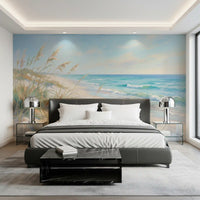 Coastal beach wall mural with turquoise waves and pale blue sky over cream sand.