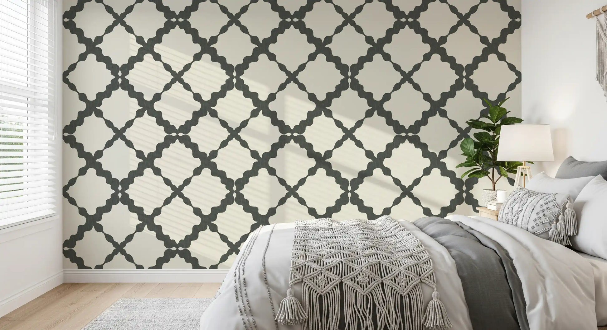 Minimalist grey and cream trellis repeat pattern wallpaper in bedroom.