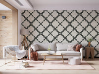 Hallway feature wall with grey and cream geometric trellis wallpaper.