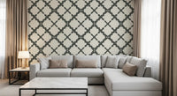 Linen-effect cream background with grey interlocking trellis geometric wallpaper in living room.