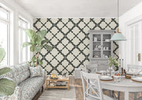 Dining room accent wall with grey trellis lattice geometric wallpaper.