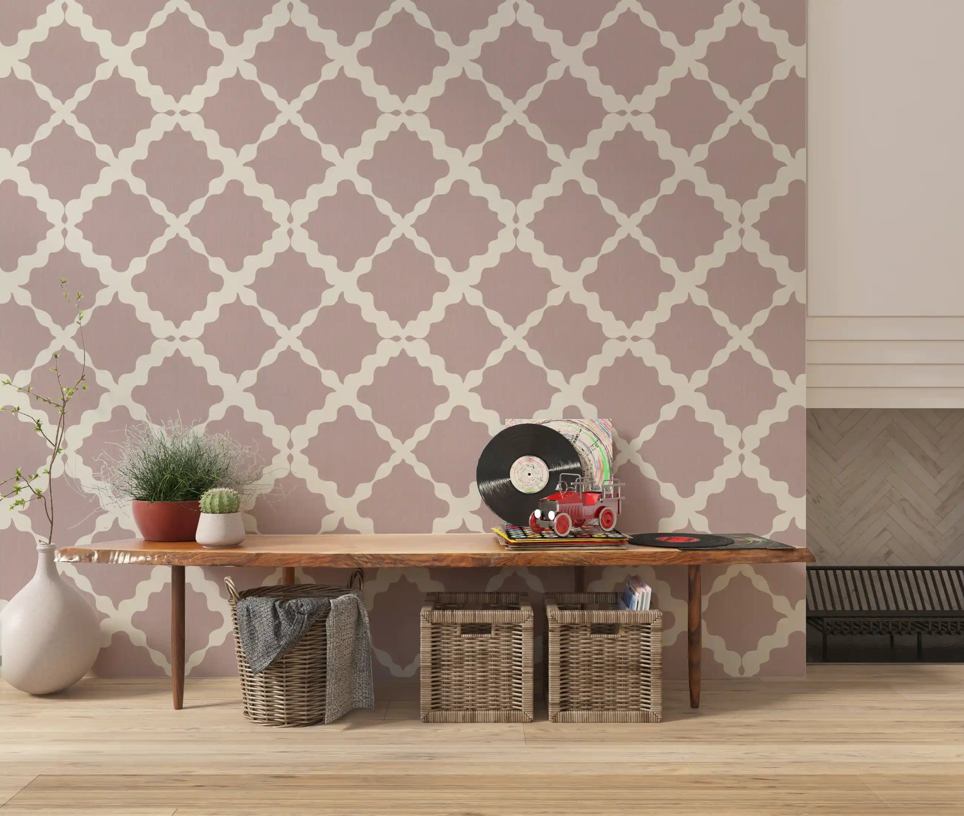 Bold trellis geometric wallpaper in soft pink applied to a hallway backdrop.