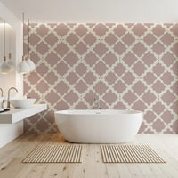 Geometric trellis lattice pattern wallpaper in dusty rose with cream-colored curved outlines.