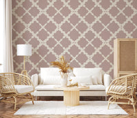 Soft pink lattice trellis wallpaper with large flowing geometric shapes and cream outlines.