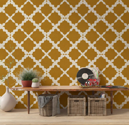 Cream ogee lattice repeat on mustard geometric wallpaper in hallway.