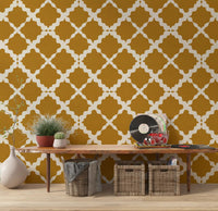 Cream ogee lattice repeat on mustard geometric wallpaper in hallway.