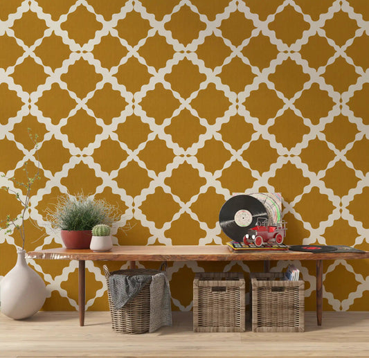 Cream ogee lattice repeat on mustard geometric wallpaper in hallway.