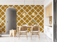 Large-scale cream lattice wallpaper on warm mustard textured background.