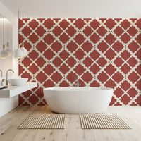 Rust red trellis pattern on cream linen-texture wallpaper in bathroom.
