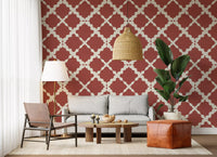 Rust red trellis wallpaper on a living area wall with large lattice pattern