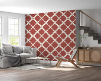 Bold rust lattice wallpaper in a hallway with cream interlocking motif. 