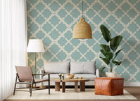 Dusty blue lattice trellis geometric wallpaper with cream curved pattern on textured background.