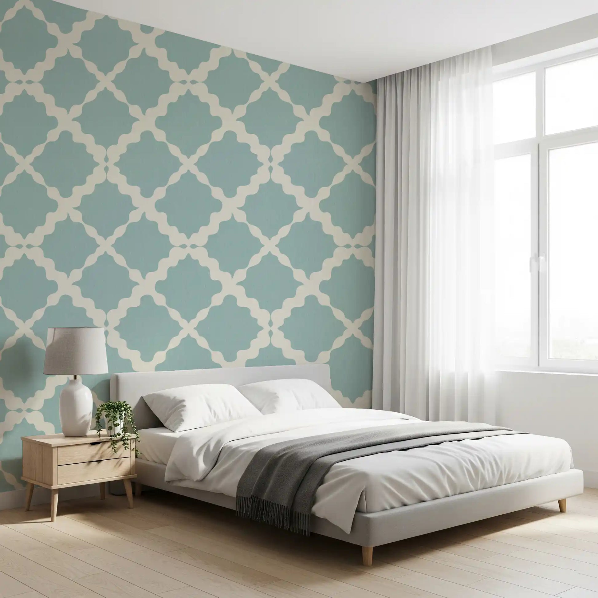 Muted blue trellis lattice geometric wallpaper with cream interlocking curves on linen-textured surface.