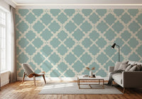Off-white and teal blue interlocking geometric trellis wallpaper with linen-like background.