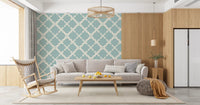 Large-scale repeating curved lattice motif in muted blue on textured wallpaper.