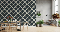 Geometric lattice wallpaper with dark charcoal and off-white trellis design.
