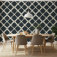 Dining room feature wall with charcoal cream geometric trellis wallpaper. 