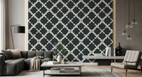 Linen-texture charcoal wallpaper with cream curved trellis geometric pattern.