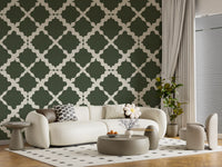 Geometric moss green trellis wallpaper installed in a living room as a feature wall.