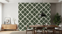 Deep green and off-white geometric lattice repeat wallpaper with curved trellis motifs.