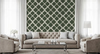 Cream and moss green geometric lattice wallpaper in a hallway.