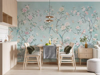 Floral birds wall mural in dining room with soft teal and white blossom motifs.