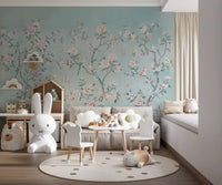Chinoiserie aviary wall mural with blooming peonies and colourful birds on teal background.