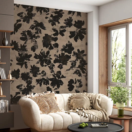 Living room wall covered with distressed black floral silhouette mural in beige. 