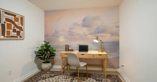 Study room accent wall featuring beach sunrise mural in peach and teal shades
