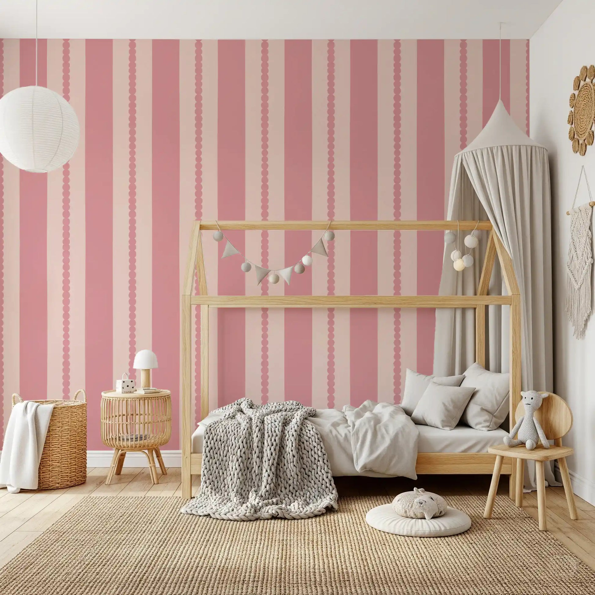 Blush stripe wallpaper on a children's bedroom feature wall.
