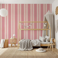 Blush stripe wallpaper on a children's bedroom feature wall.