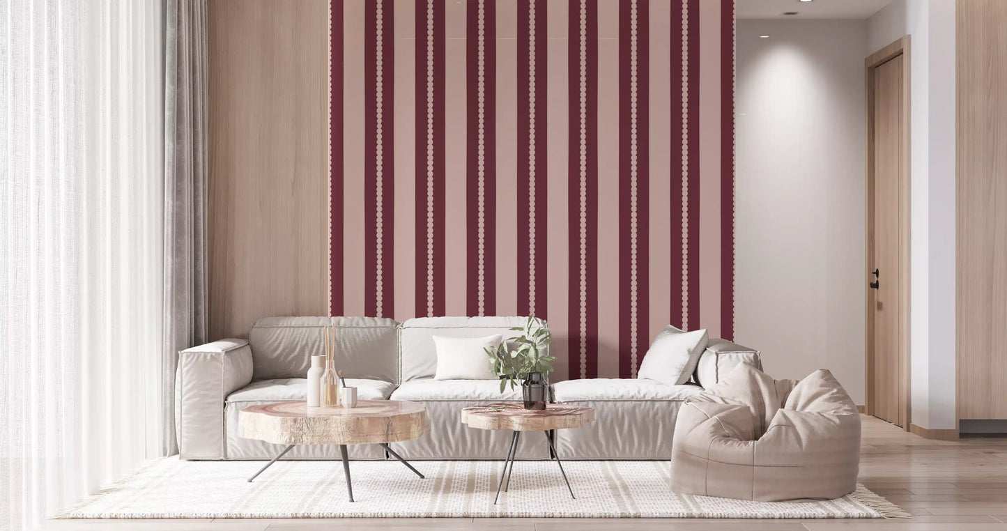 Living room feature wall with blush berry striped scallop wallpaper.