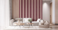 Living room feature wall with blush berry striped scallop wallpaper.