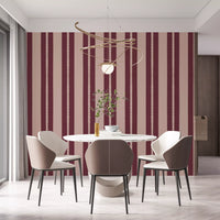 Dining room decorated with blush and berry vertical stripe wallpaper.