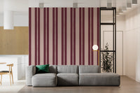 Living room accent wall with blush and berry scallop stripe wallpaper. 