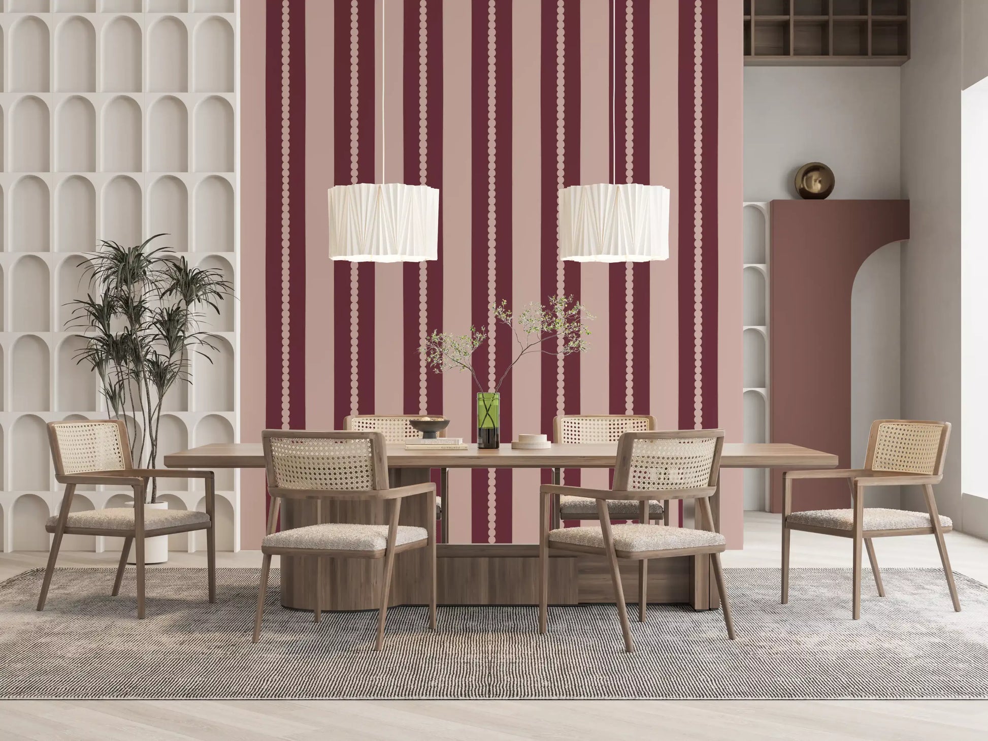 Deep berry and soft blush alternating stripe pattern wallpaper in dining room.