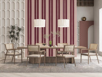 Deep berry and soft blush alternating stripe pattern wallpaper in dining room.