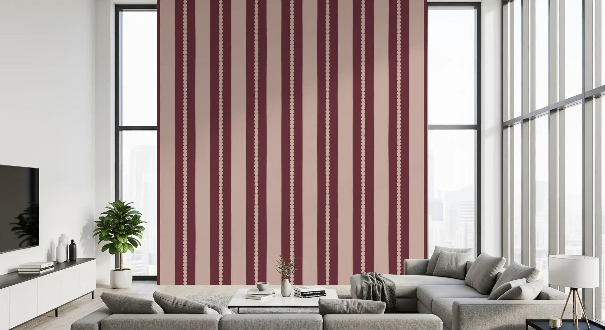 Living room interior wall with bold scallop stripe wallpaper in berry and blush.