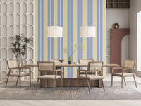 Cream vertical stripes with scalloped wavy edges on a blue striped wallpaper.