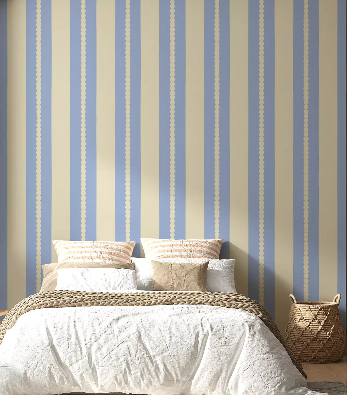 Scalloped stripe blue and cream wallpaper on a bedroom accent wall. 