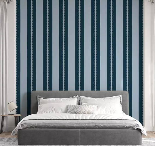 Bedroom wall with scallop dot vertical stripe teal blue wallpaper. 