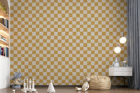 Large-scale wavy golden checks wallpaper close-up detail showing curved grid.