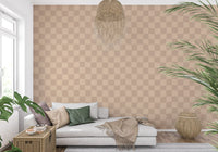 Two-tone muted check wallpaper in a sunlit living room.