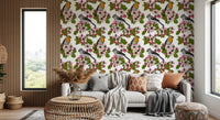 Detailed bird illustration among pink flowers and green leaves wallpaper.