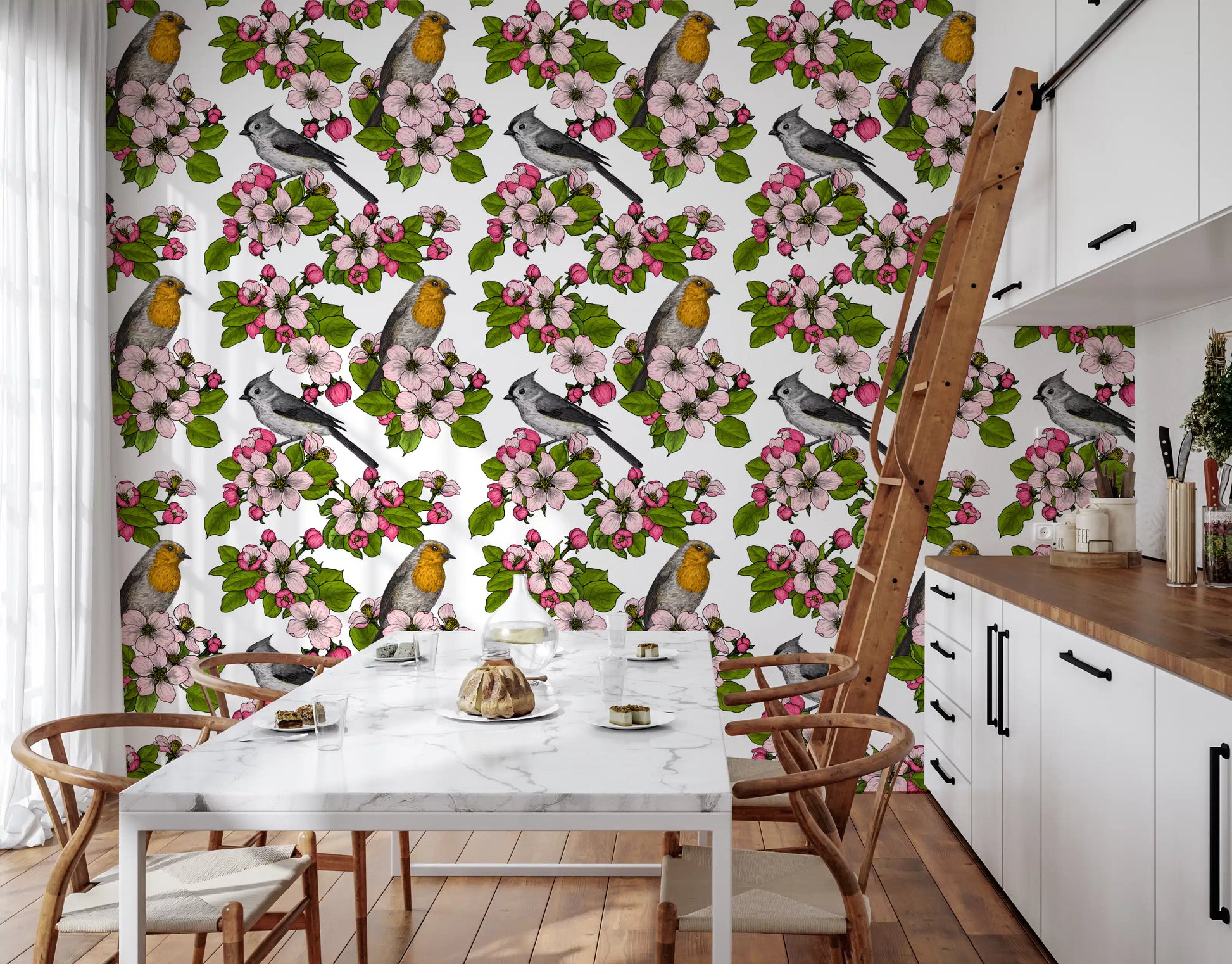 Dining room wall with botanical bird and blossom wallpaper on white.